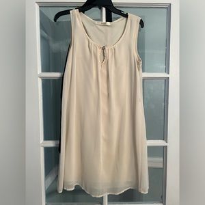 Cream colored dress with optional black tie around